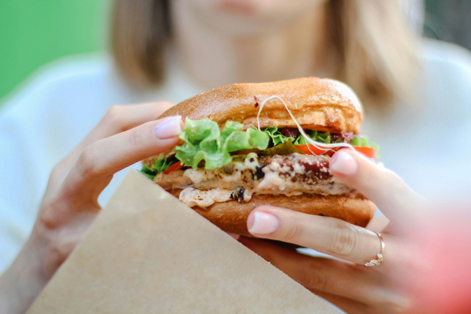 Woman holding a burger