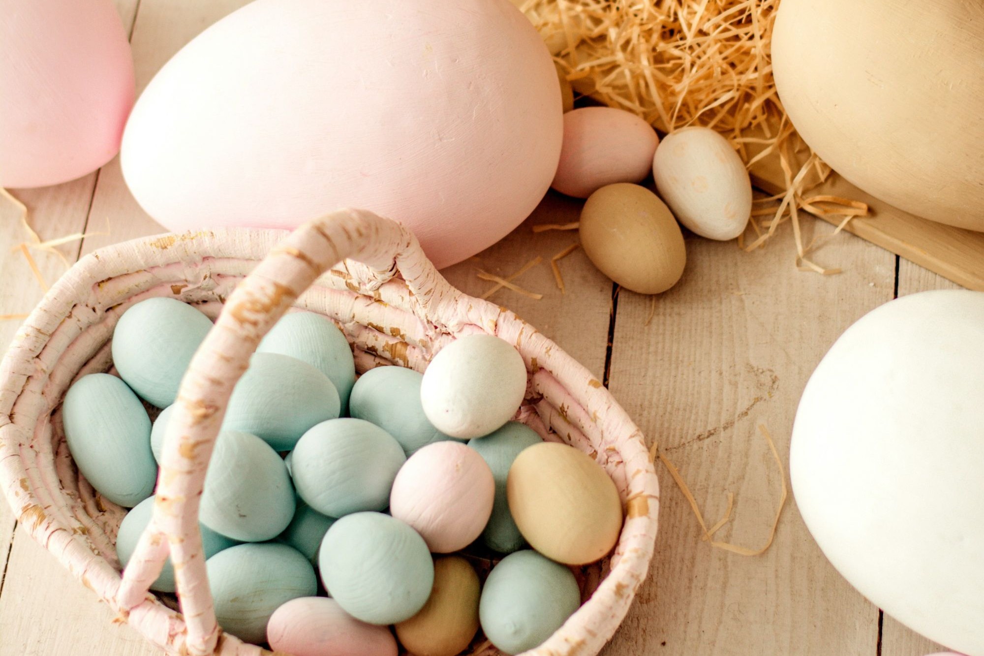 A basket filled with colourful Easter eggs.