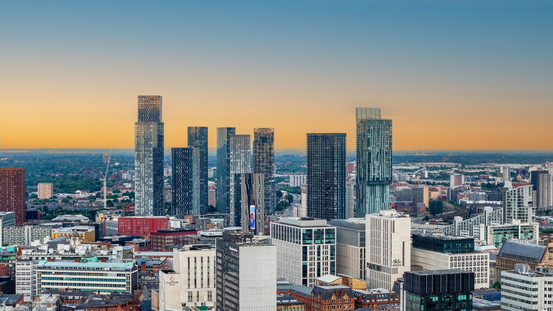 The modern Manchester skyline at sunset