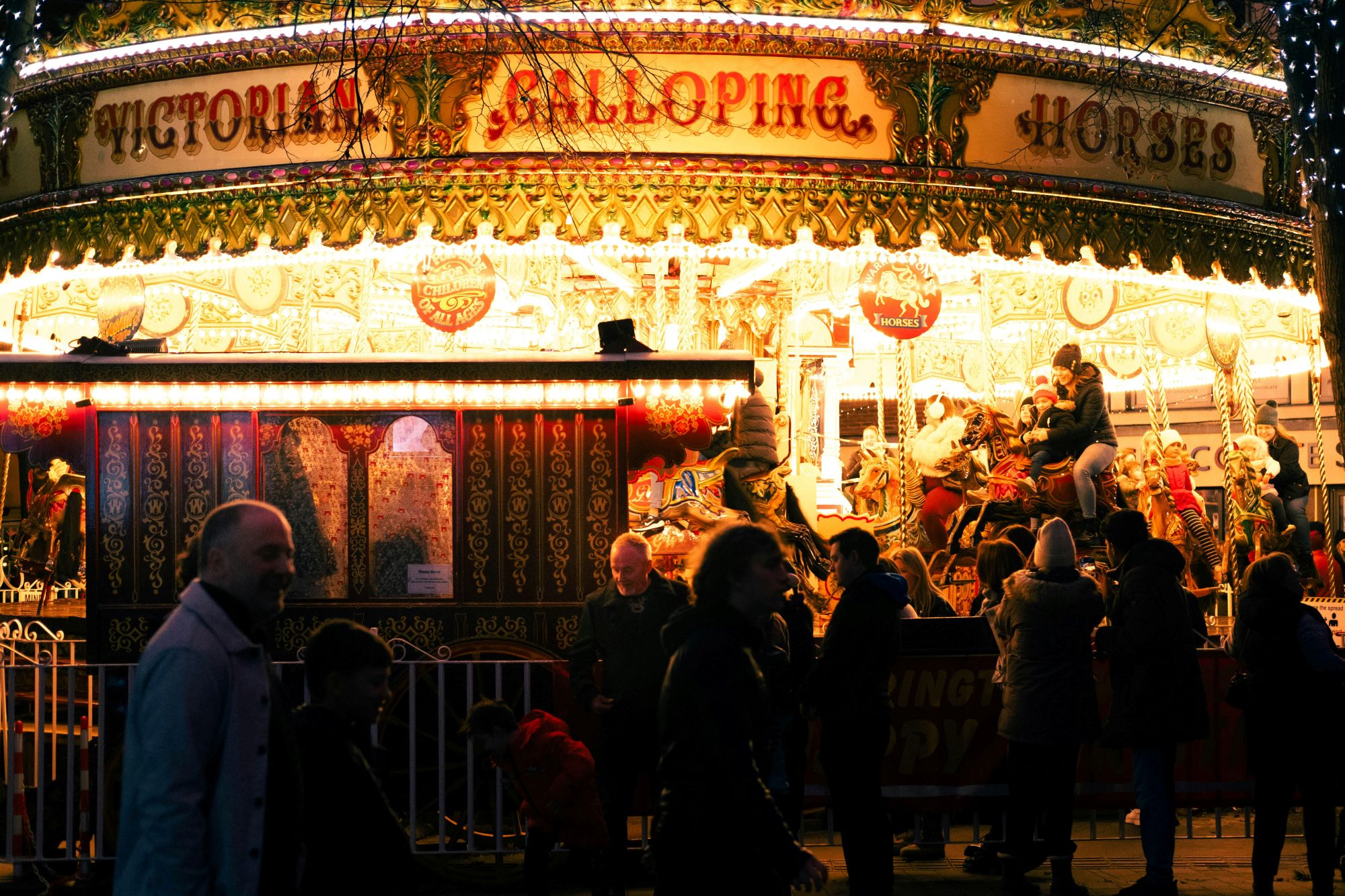 A brightly lit carousel at York Christmas Market.