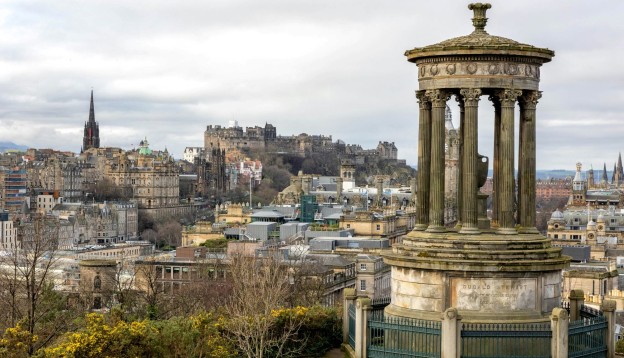 The Dugald Stewart Monument on Calton Hill overlooking the historic Edinburgh skyline