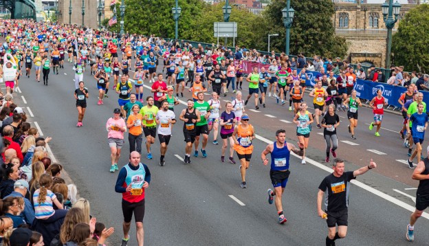 A group of people running the Great North Run in Newcastle.