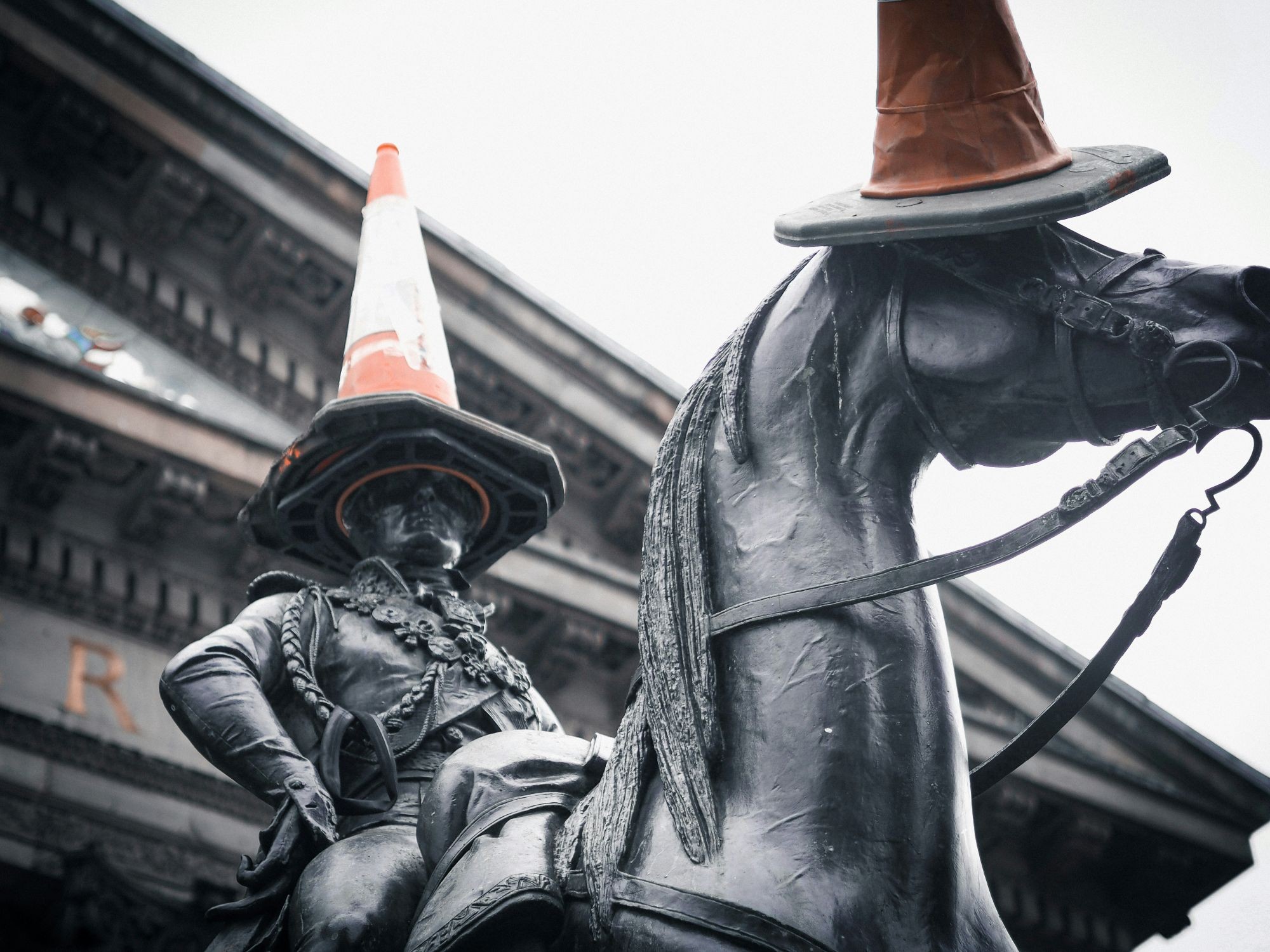 Statue of the Duke of Wellington in Glasgow with a cone on his head.