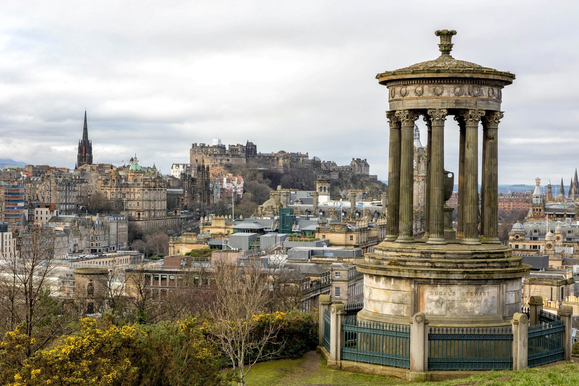 The Dugald Stewart Monument on Calton Hill overlooking the historic Edinburgh skyline