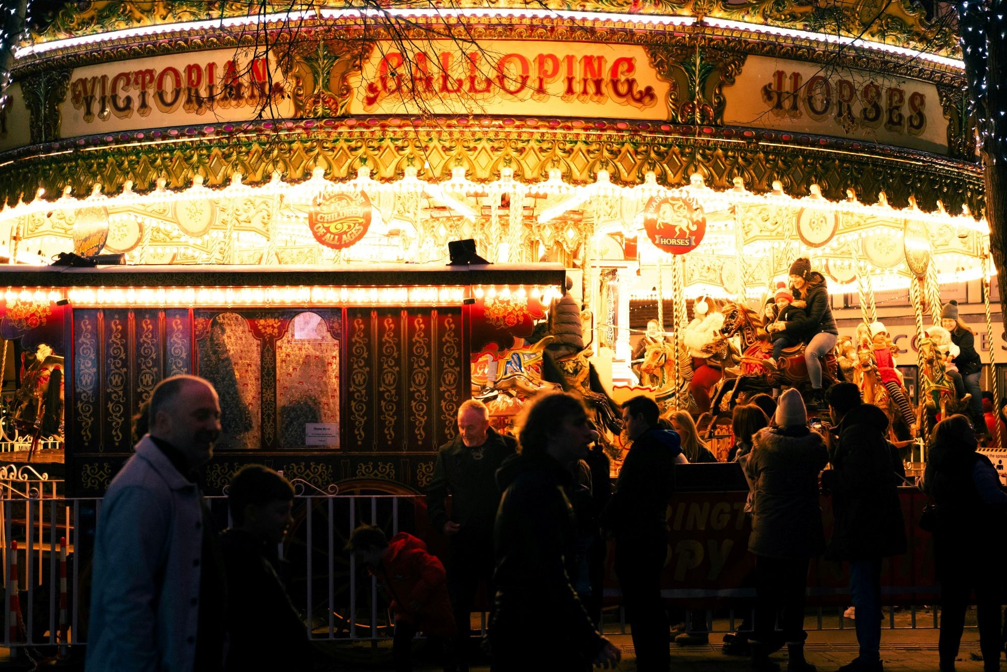 A brightly lit carousel at York Christmas Market.