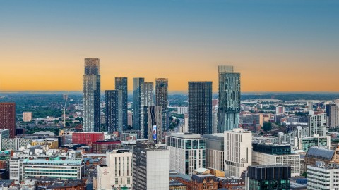 The modern Manchester skyline at sunset