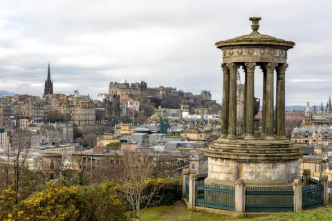 The Dugald Stewart Monument on Calton Hill overlooking the historic Edinburgh skyline