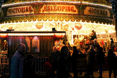 A brightly lit carousel at York Christmas Market.