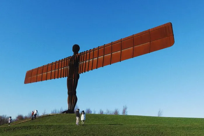 Angel of the North against a clear blue sky.