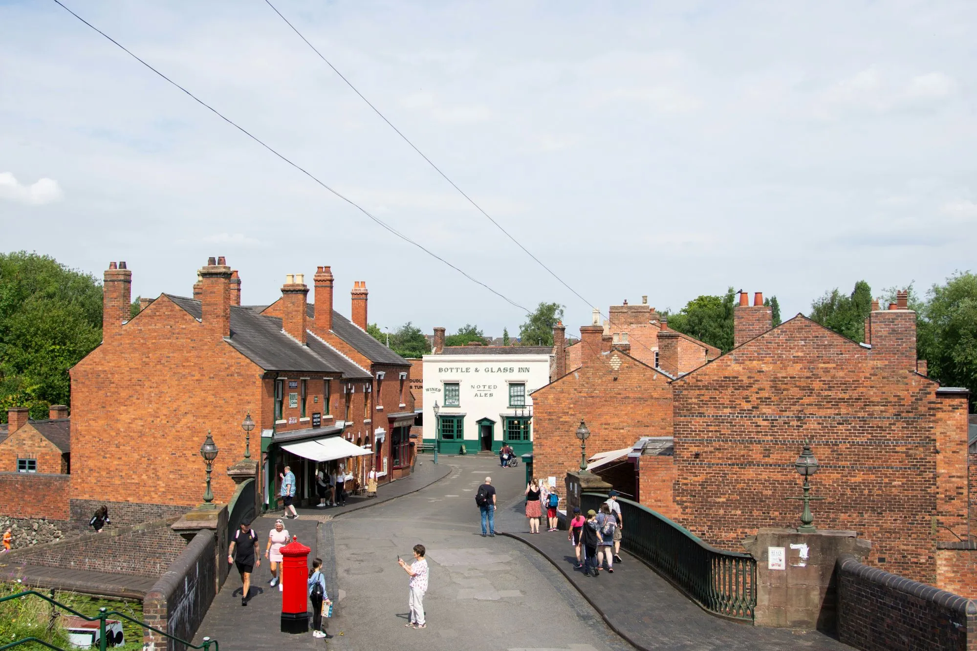 High-angle view of visitors walking down a historic street at the Black Country Living Museum.