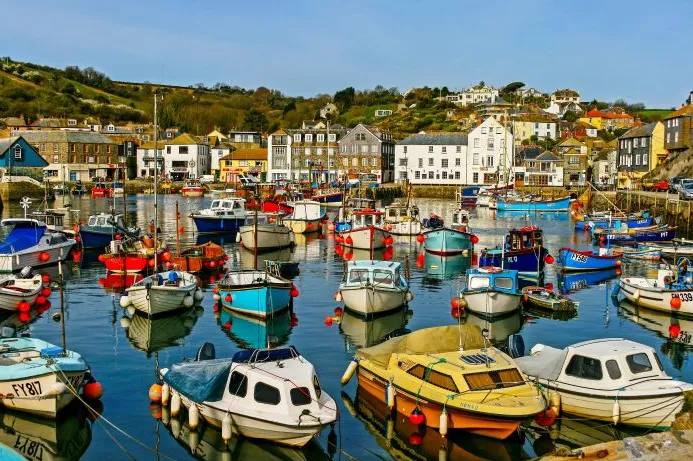Boats in a harbour in the fishing village of Mevagissey, Cornwall.