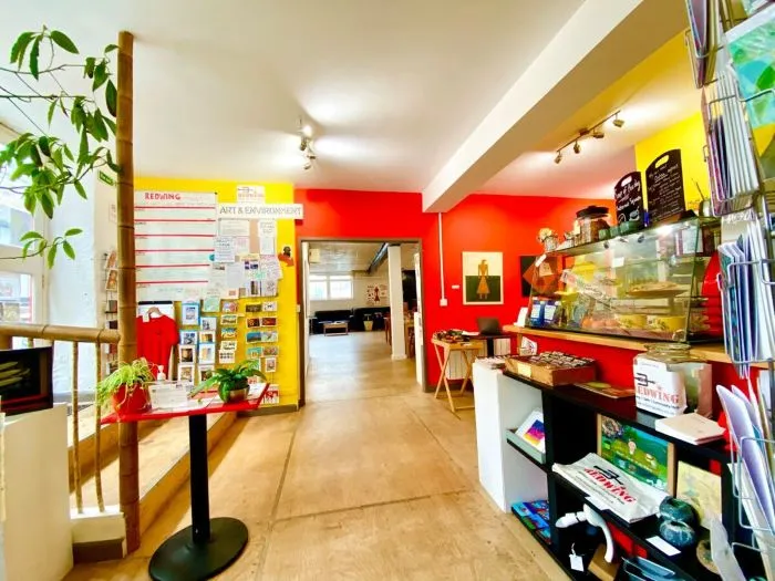 The interior of Redwing Gallery Café, featuring red and yellow walls.