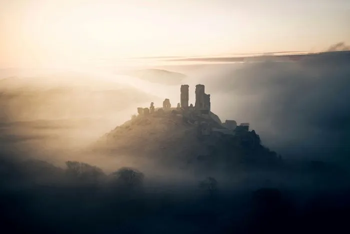 A foggy sunrise at Corfe Castle.